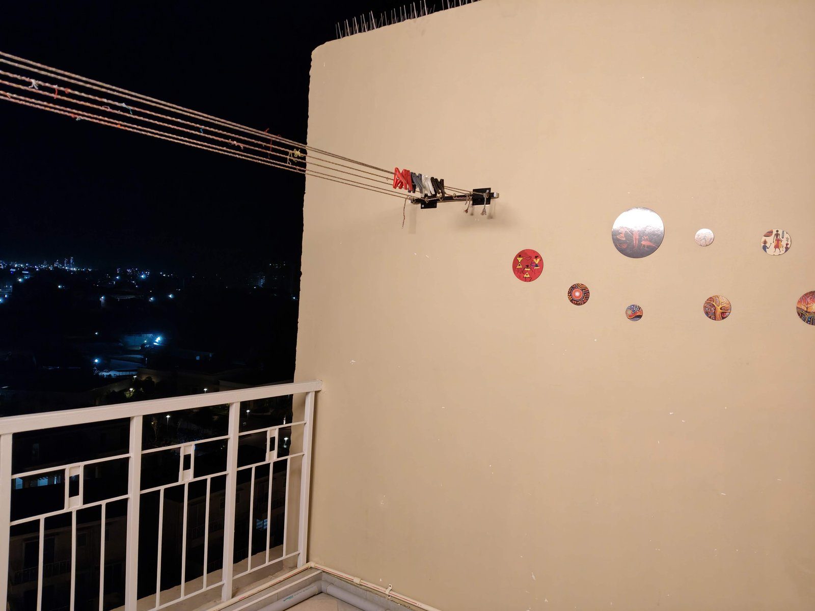 Terrace at night with city lights in the distance