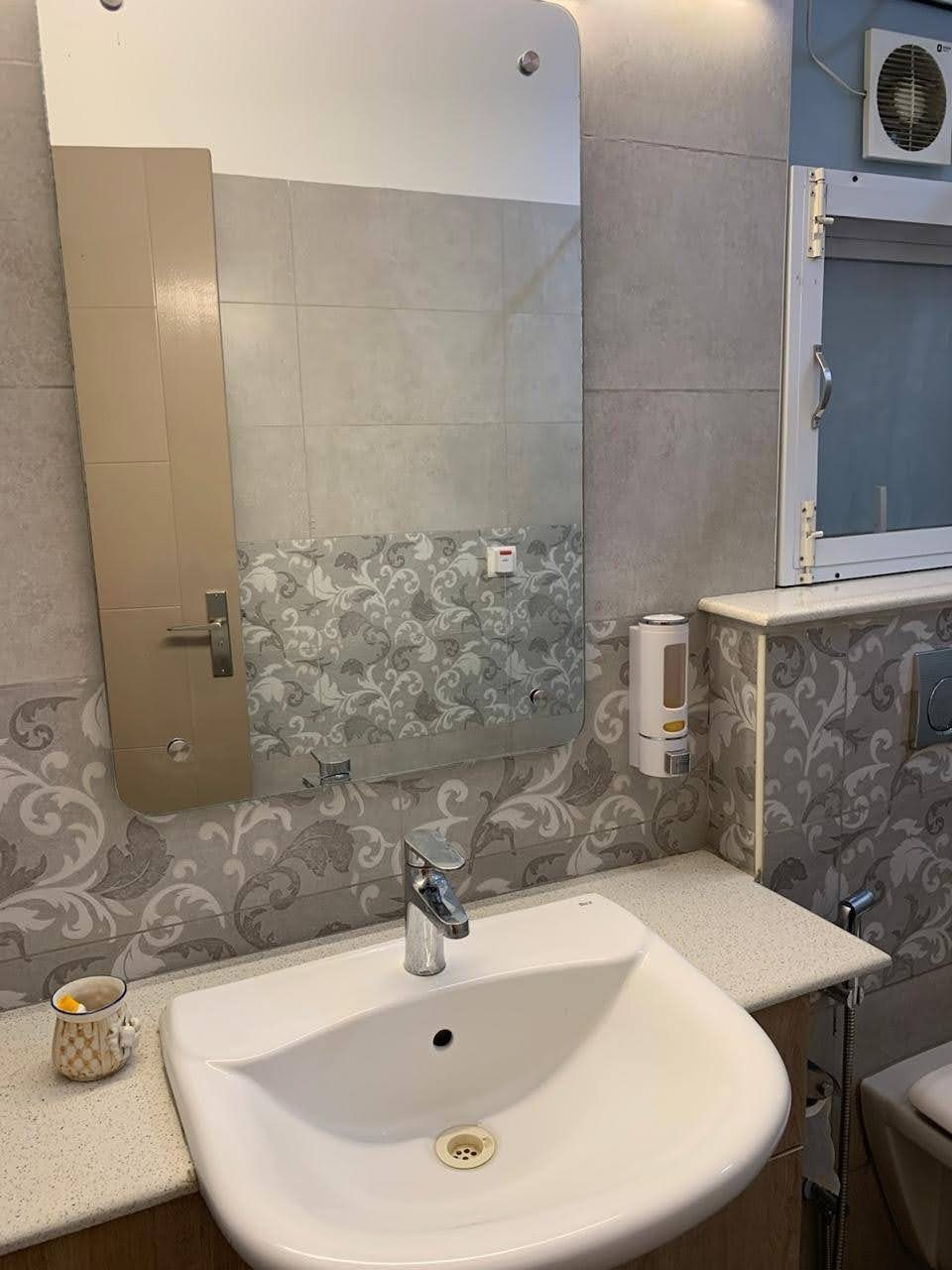 Bathroom vanity with mirror and tap